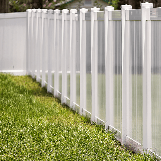 Residential wood fence with cap and trim