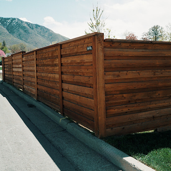 Board on board horizontal wood fence installed by The Fence Company