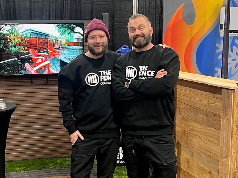 The Fence Company owners standing in their fence showroom