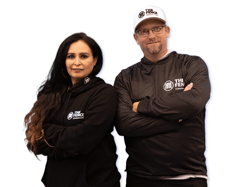 The Fence Company owners standing in their fence showroom